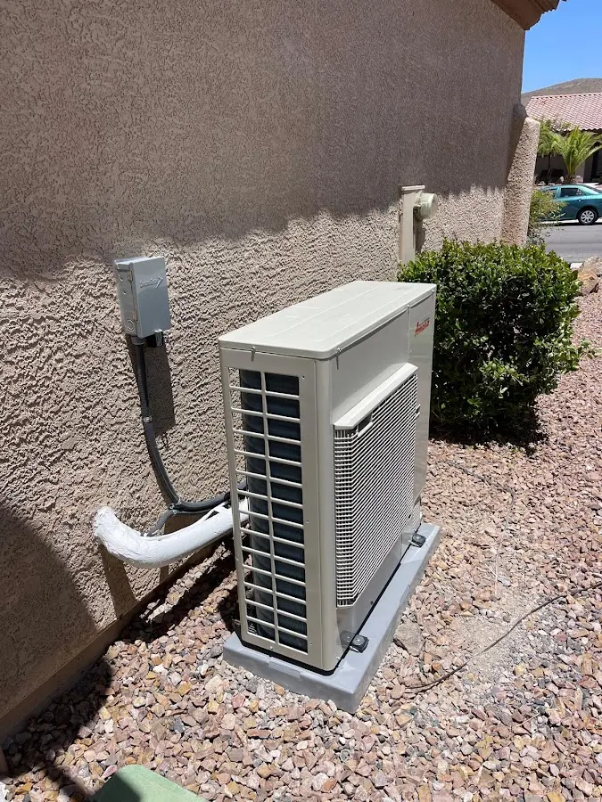 Residential air conditioning condenser unit in Pine