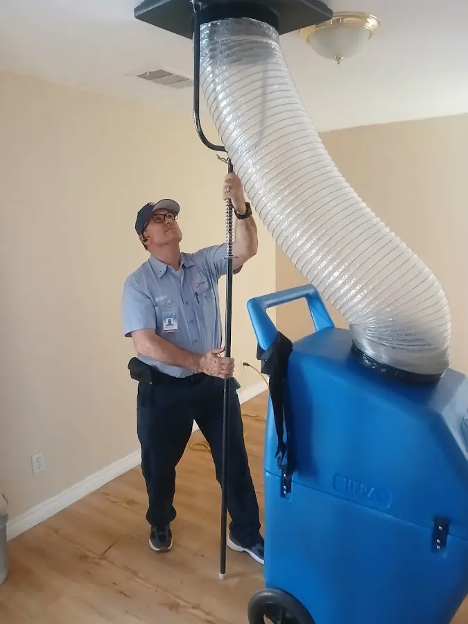 Furnace Tune-Up technician using HEPA equipment in Pine